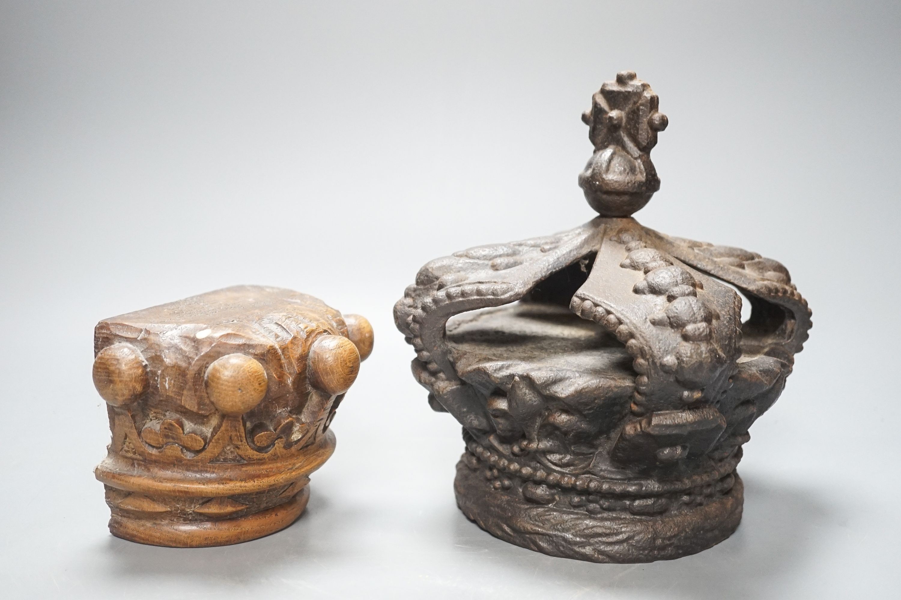 A Victorian cast iron model of a crown and a carved wood crown appliqué 21cm